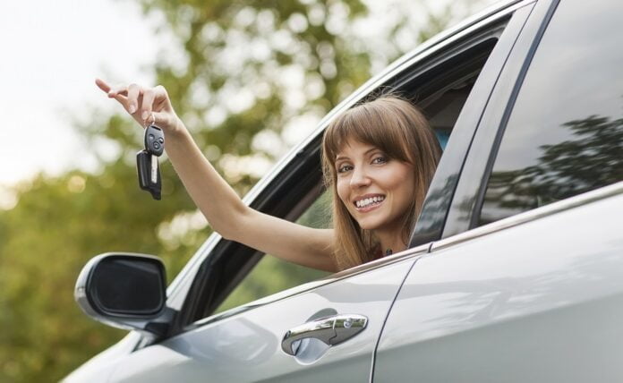 Caucasian car driver woman smiling