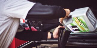 topping up oil in a car