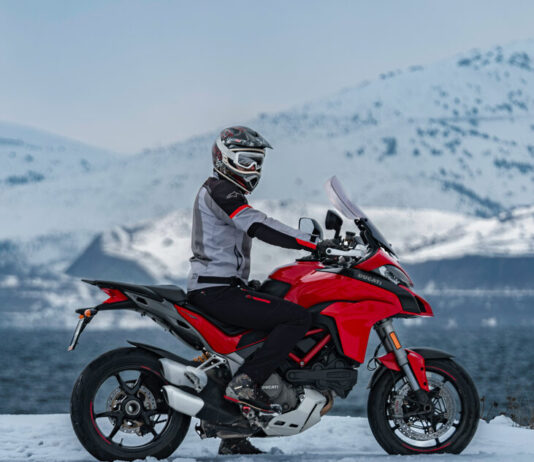 Winter Wheels: 3 Unforgettable UK Motorcycle Trips for the Holidays motorbike in the mountains