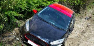 ford in ditch on dirt road