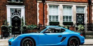 blue porsche in city street