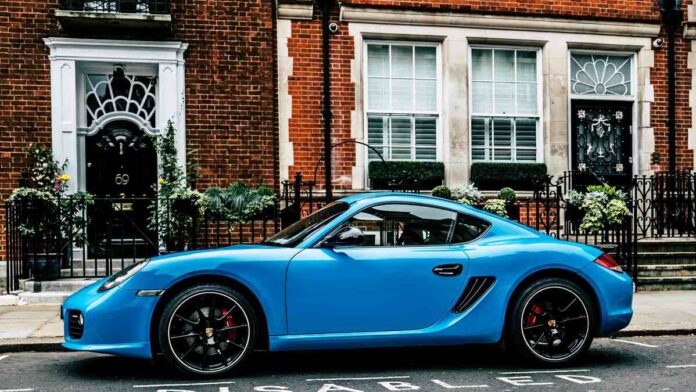 blue-porsche blue porsche in city street